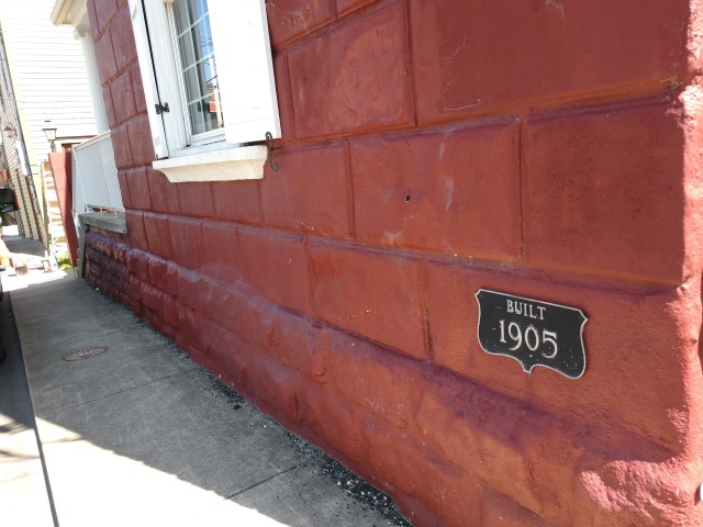 Plaque showing the date of construction is located on front of building facing Court Street (view from northwest to southeast)
