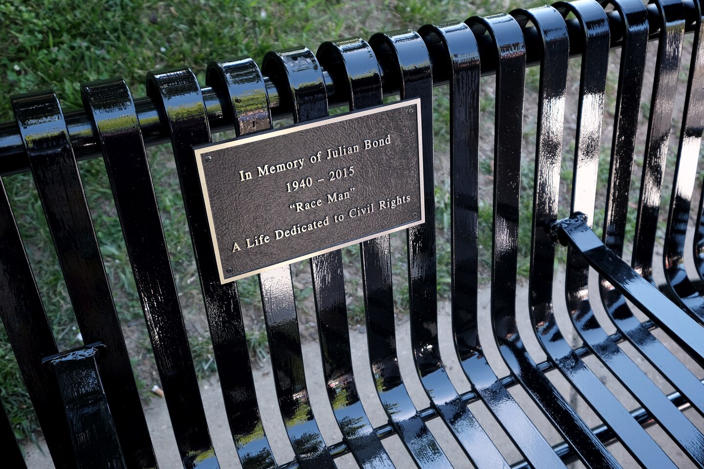 The bench's plaque that memorializes civil rights leader, Julian Bond. 