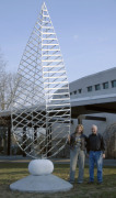 Artist Johnathan Cox beside the Arts Center's first permanent outdoor sculpture, The Discovery IV.