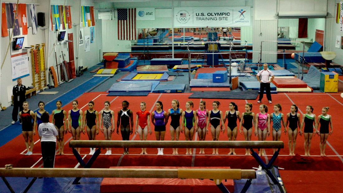 Martha Karolyi speaker to the gymnasts inside of the ranch
