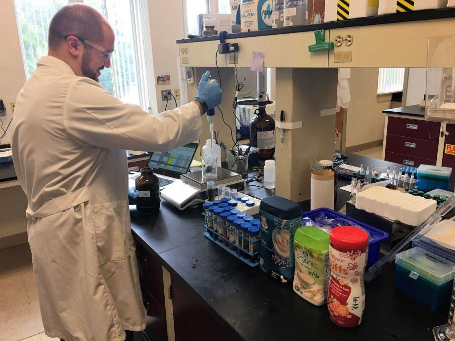 A research technician from CAES' Department of Analytical Chemistry conducts research.