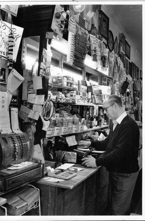 Former owner Floyd Bonafacio checking prices at his register when the store was in operation.