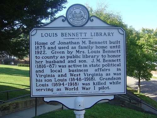 A historical marker stands in front of the house to commemorate the library. Image obtained from the Historical Marker Database.