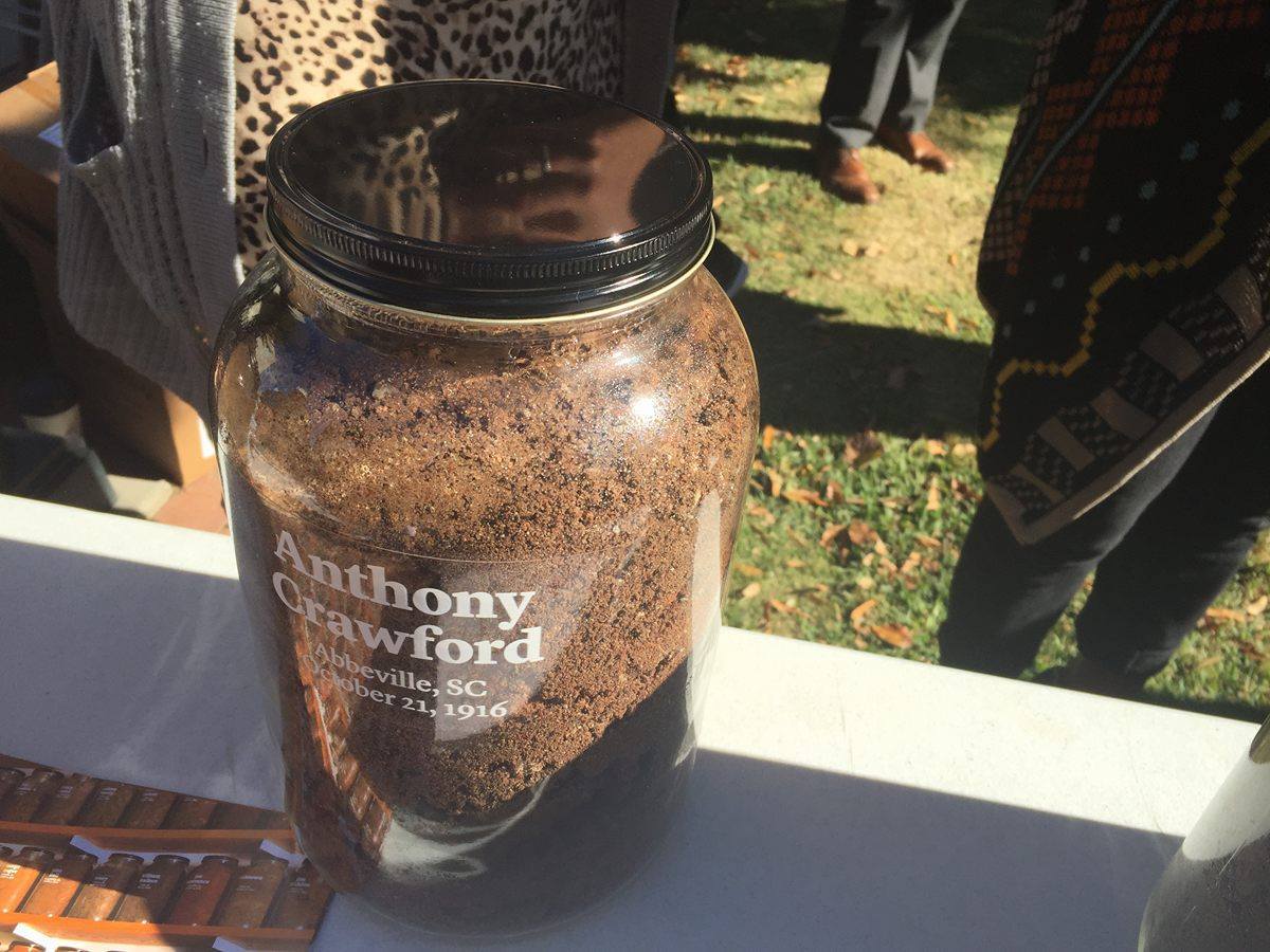 This jar of dirt was removed from the site of the lynching of Anthony Crawford and stored along with samples from other sites to create a solemn memorial to victims of racial violence.