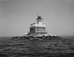 Penfield Reef Lighthouse seen from the shore of Bridgeport, Connecticut. The lighthouse is located roughly 1.3 miles offshore.