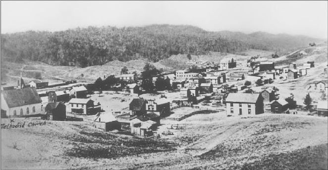 The church is Bland Street Methodist, and the knoll in the back center is where the Bailey Building now stands. Photo from Bluefield by William R. Archer.