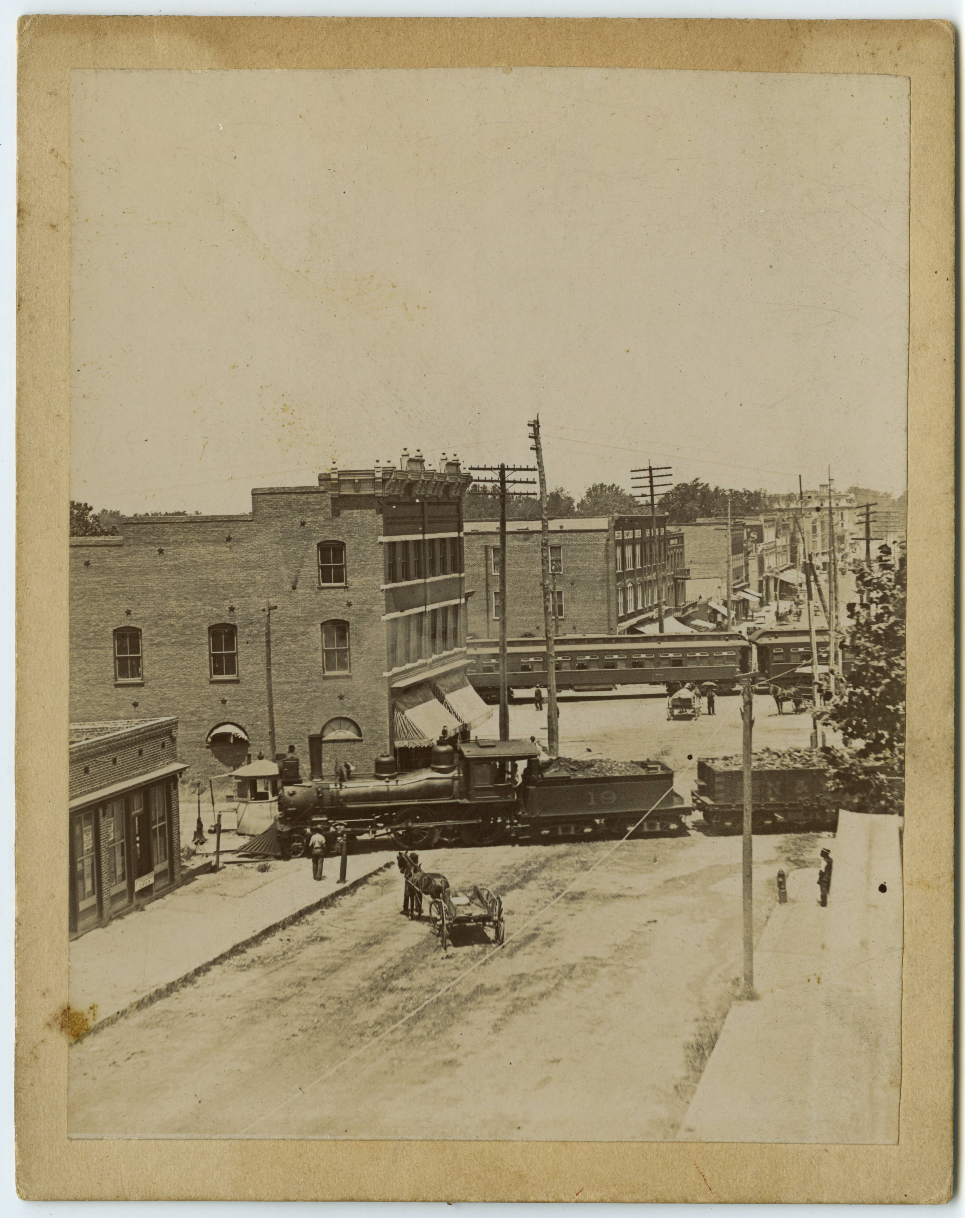 S. Elm St. railroad crossings, ca. 1900. Building slightly left of center is the Cascade Saloon.