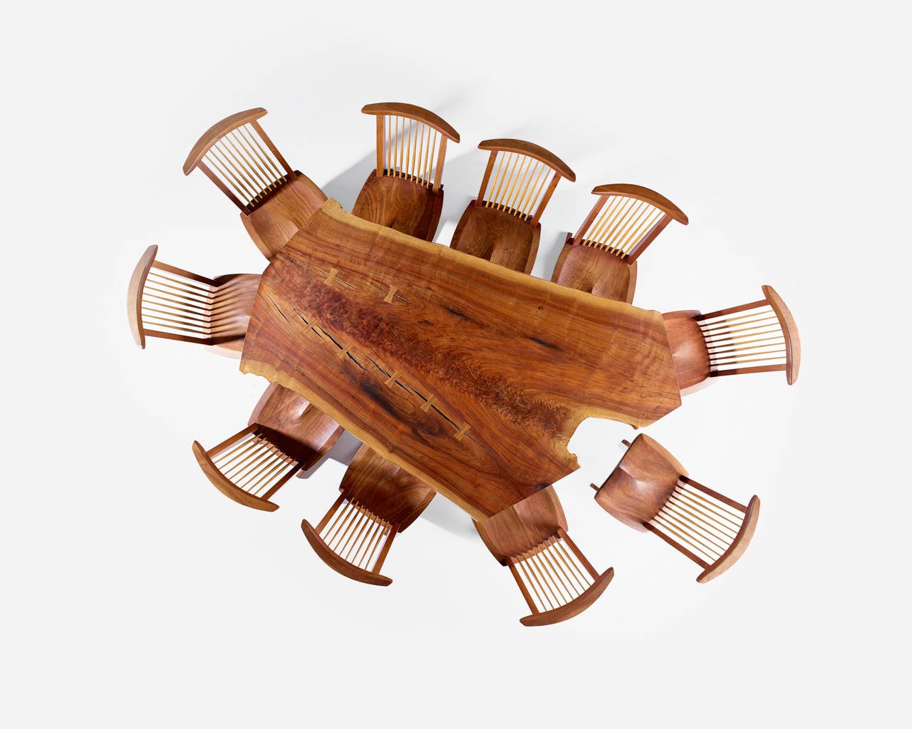 An overhead shot of a Nakashima dining table and chairs.