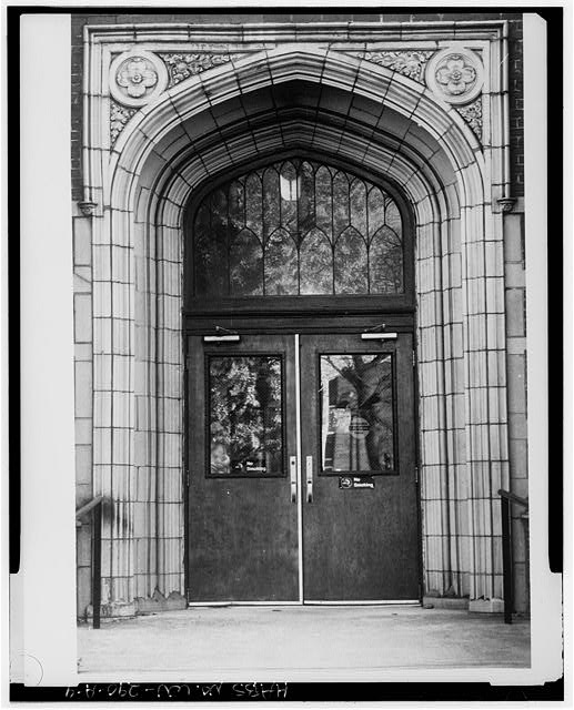 When Northcott Hall was demolished, the stone arch entrance was preserved and used in the design of the library as a window.