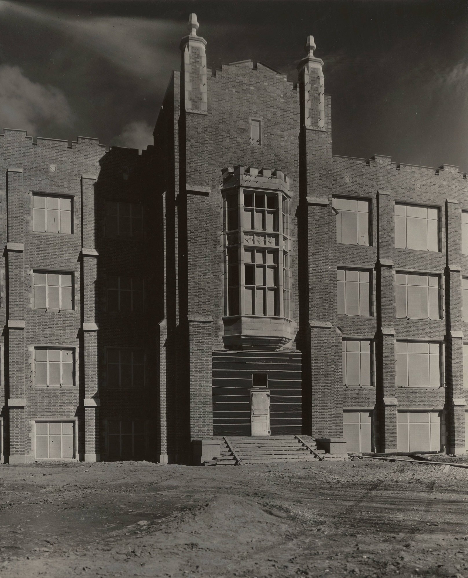 Merrifield Hall with boarded up windows and doors prior to finishing construction.