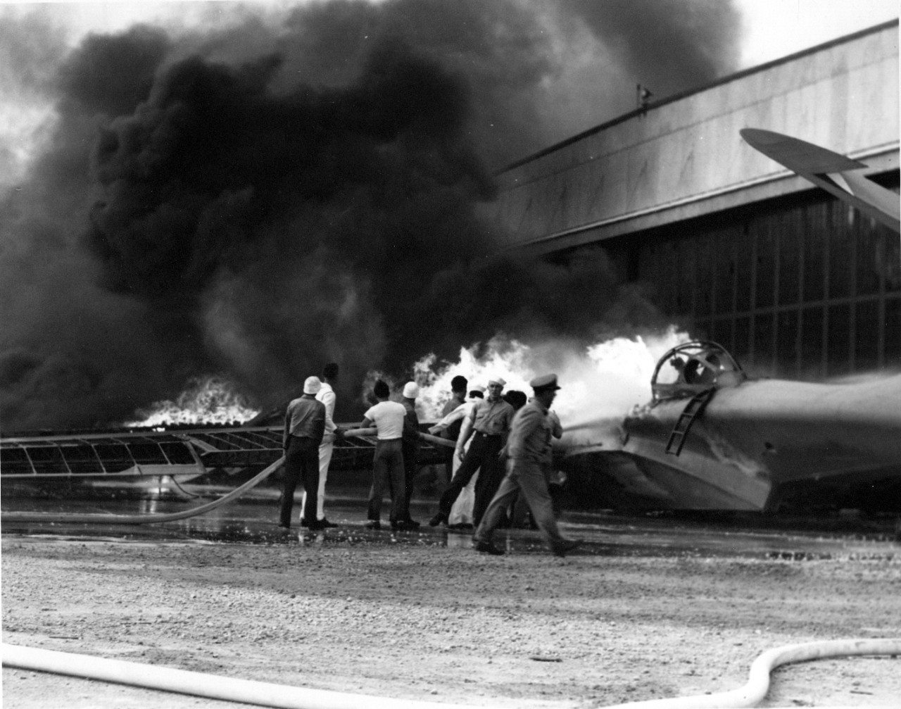Soldiers putting out a fire in a PBY patrol bomber.
