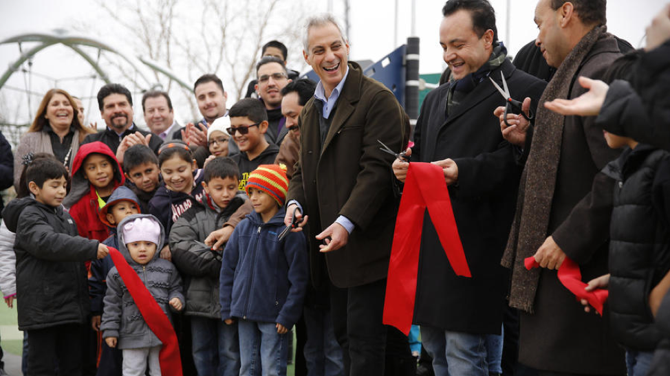 The photo taken at the ribbon cutting for La Villita Park shows the community adults and the politicians that fought for it for their benefit as well as the benefit of the children crowded into the scene ready to play.