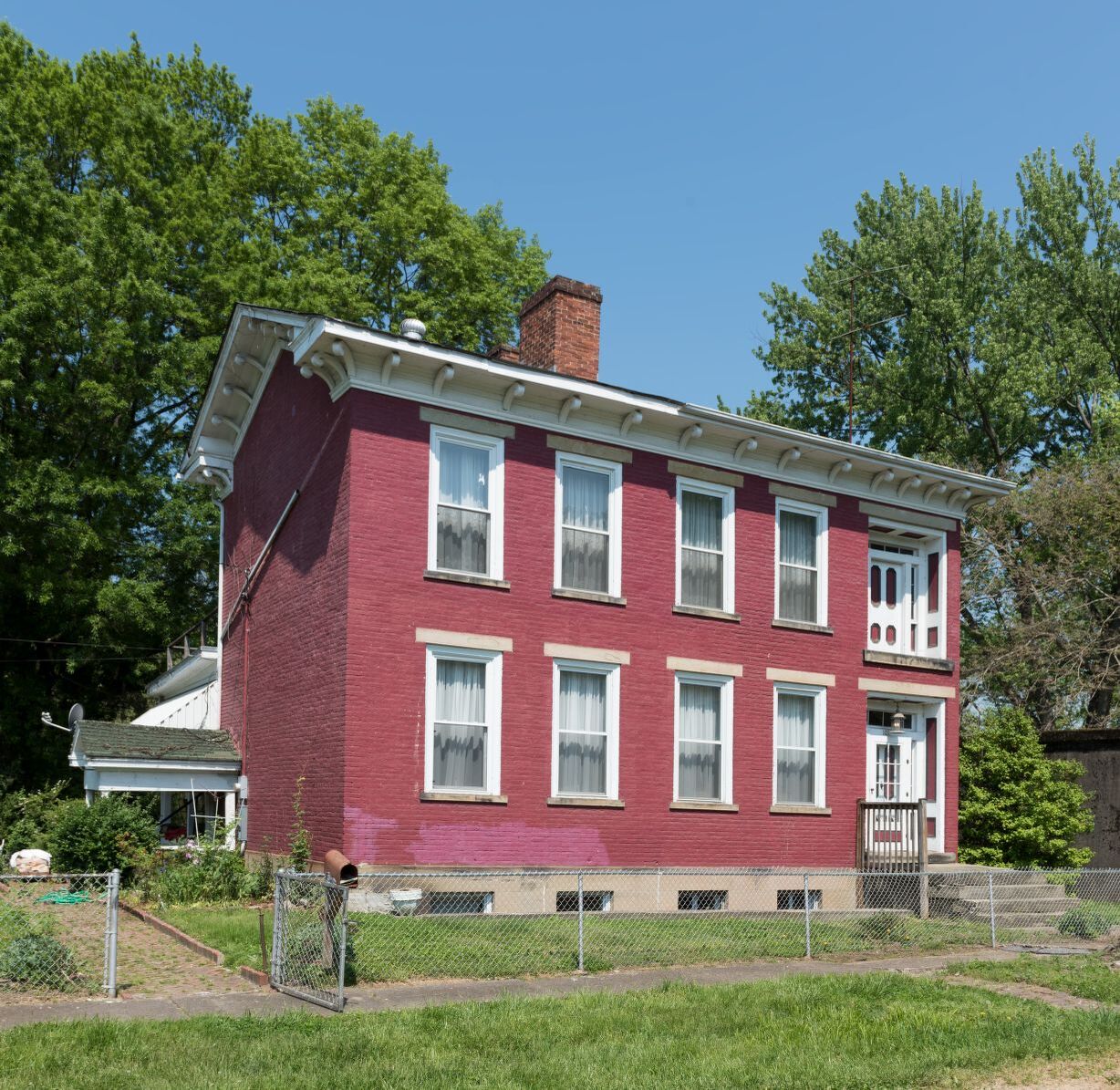 The Federal style house notably has a second story front door, an indication that the home once had a second story veranda. Image obtained from the Library of Congress.