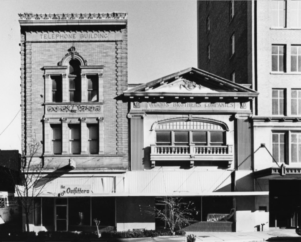 1980 photo of Woods Brothers Building (R) and Nebraska Telephone Co. Building (L) by Richard L. Johnson