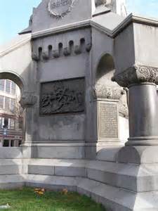 This image shows one of four plaques at the base of the monument