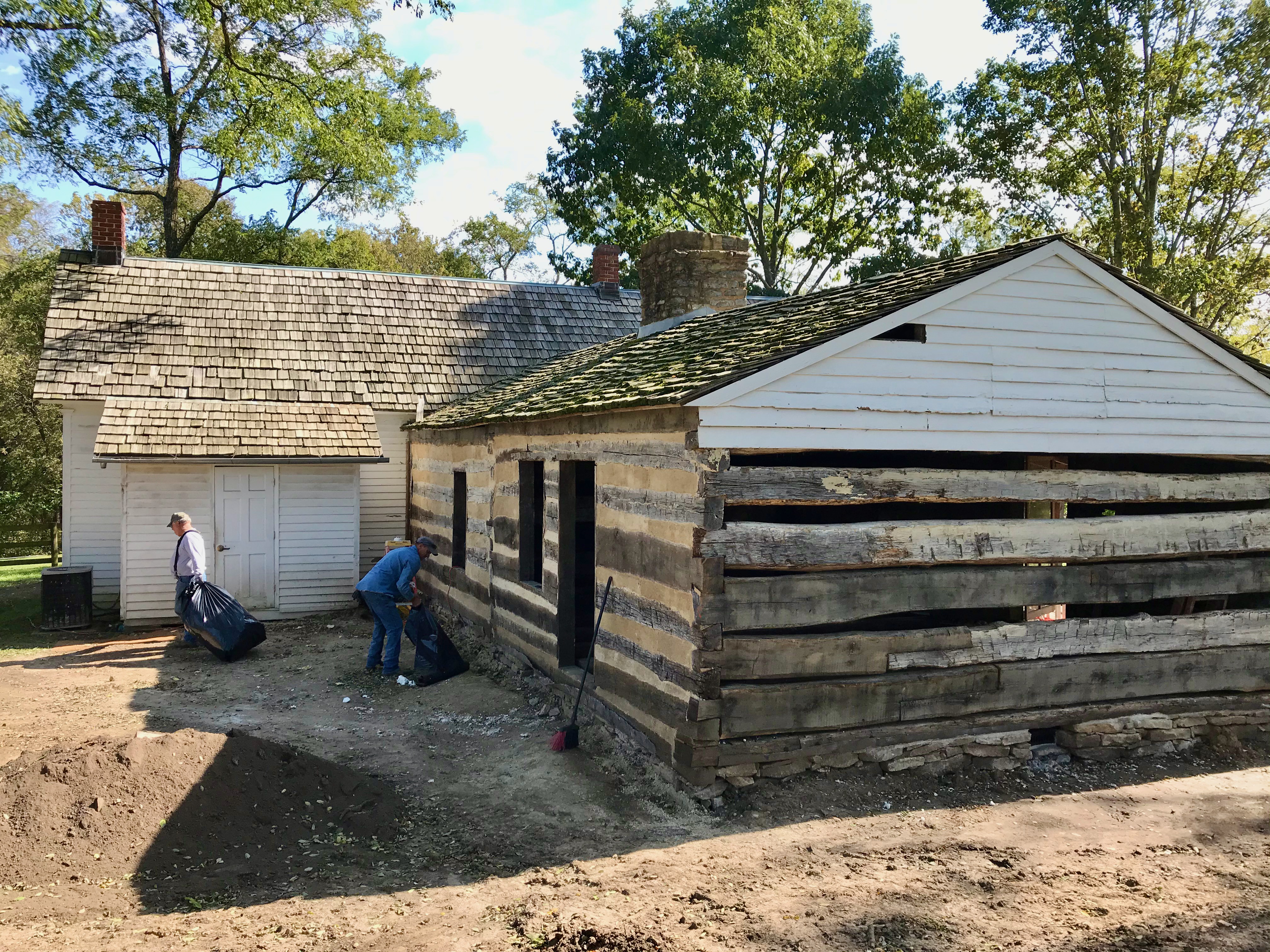 The home undergoing renovation in 2019, exposing the original 1822 log cabin