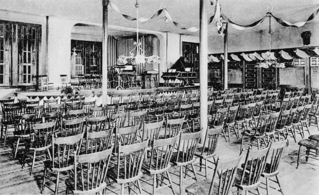 Irving College Auditorium located on the lower floor of Columbian Hall in 1910. The auditorium was set up for nondenominational chapel services.