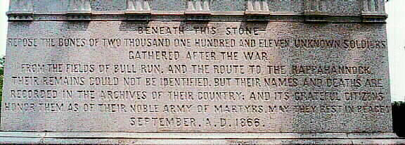 Detail view of the monument that shows the original inscription, which was retained even after the redesign