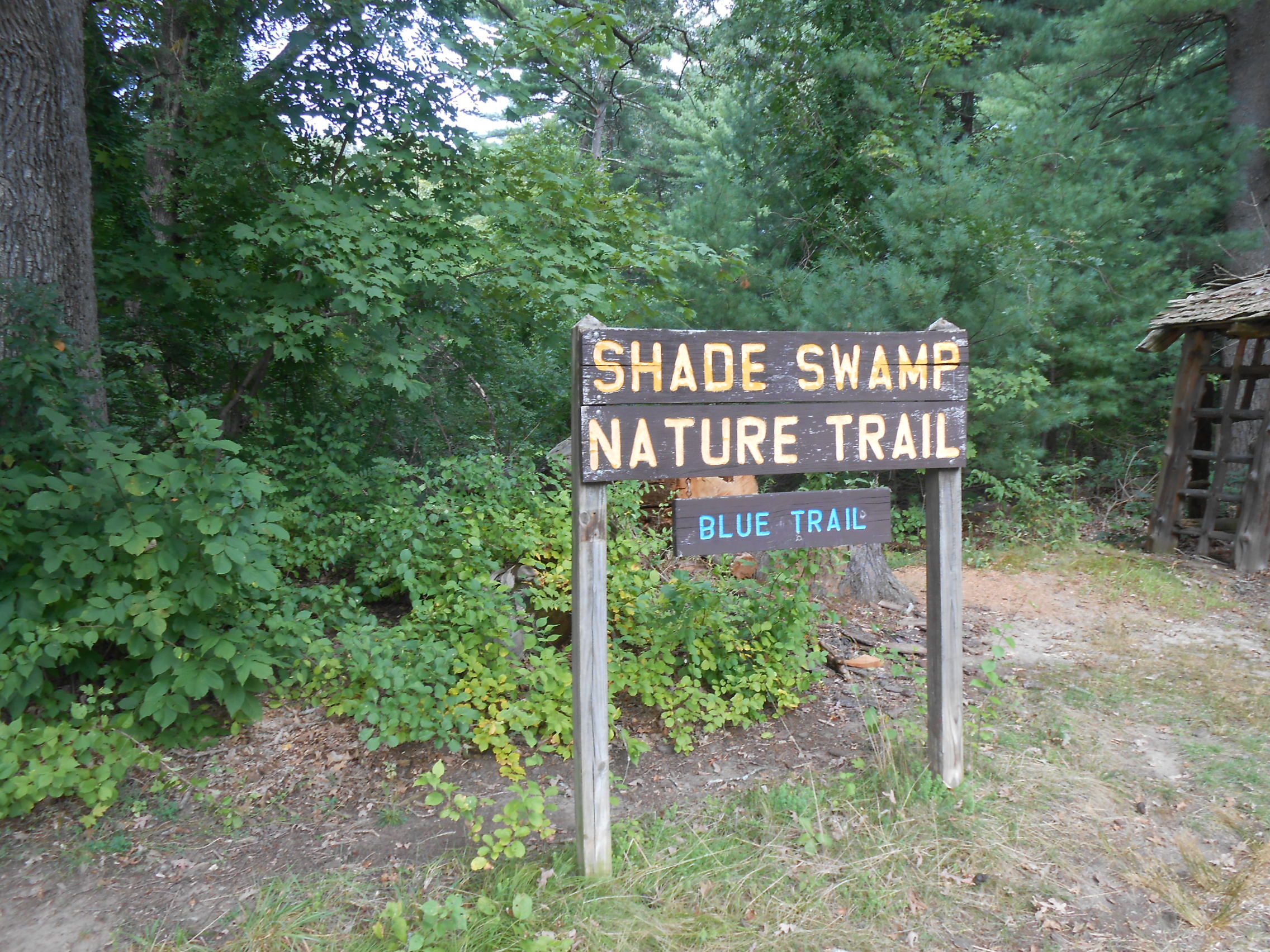 Shade Swamp Nature Trail sign in parking area