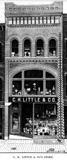 An ink illustration of a three story brick building. Each floor has large windows displaying home goods. A sign across the first floor reads "C. H. Little & Company". and a caption below the illustration reads "C. H. Little & Co's Store." To the right of the building is a tall, thin black tower with rows of white plates attached to it.