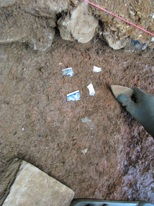 Pictured is hand painted pearlware being excavated at Mead's Tavern