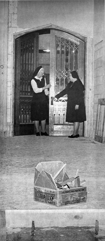 During construction of the new motherhouse at 475 Gillett St., Sisters Imogene Palen and John Baptist Shaja examine the chapel doors which came from the convent at 390 E. Division St., February 1975.