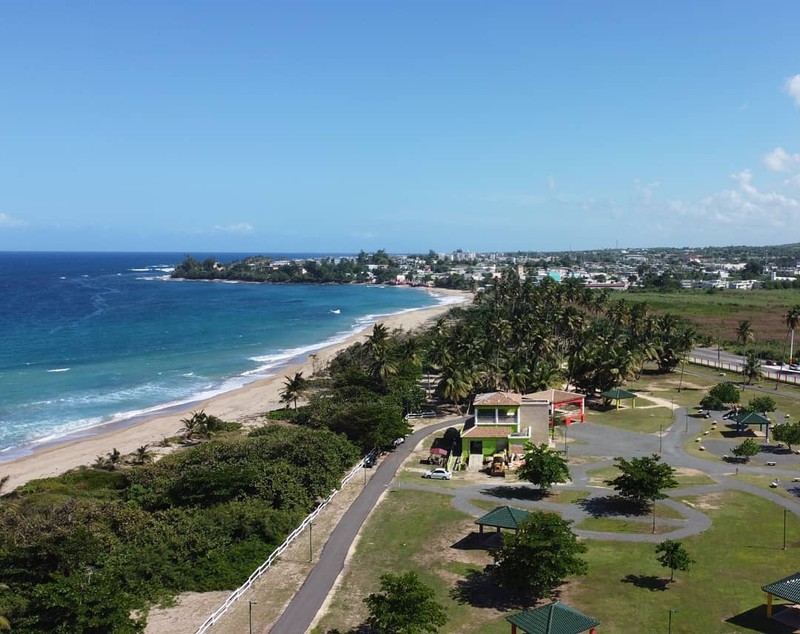 The view of the beach known as "Rio Mar" with the city of Hatillo in the background; it is a beach on the coast of two municipals (Hatillo and Camuy).