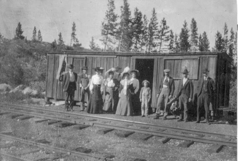 A group of people at the Frisco Depot located at the base of Mount Royal. Women frequently traveled in nicer clothing, complete with hat and jackets. 