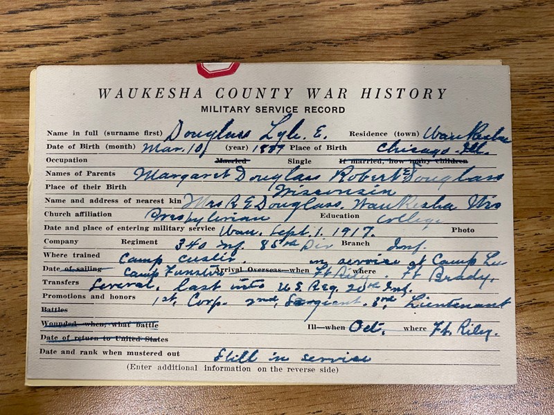 This is an average sized card with information filled out about Lyle. The information is handwritten on blank spaces, and are inclusive of facts such as place and date of birth, name, next of kin and their address, where the soldier trained, if they were wounded in battle and so on.