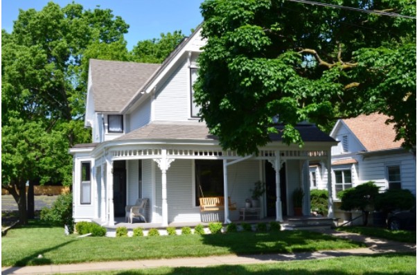 White house with wrap-around porch 