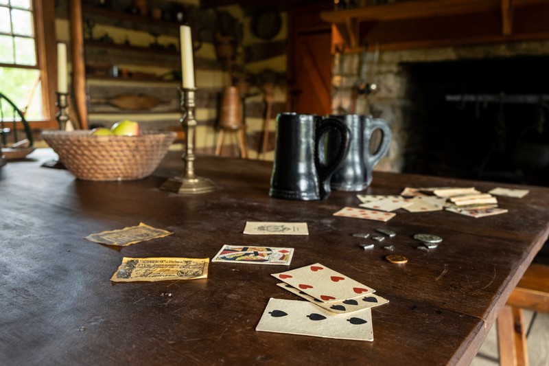 A game of cards on the tavern table