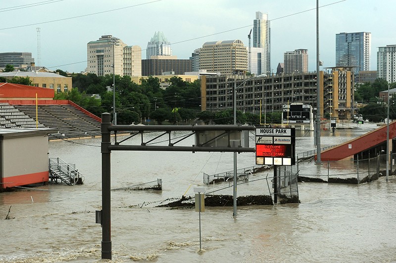 The destruction of the Memorial Day Floods of 2015, an entire football stadium is engulfed by flood water.