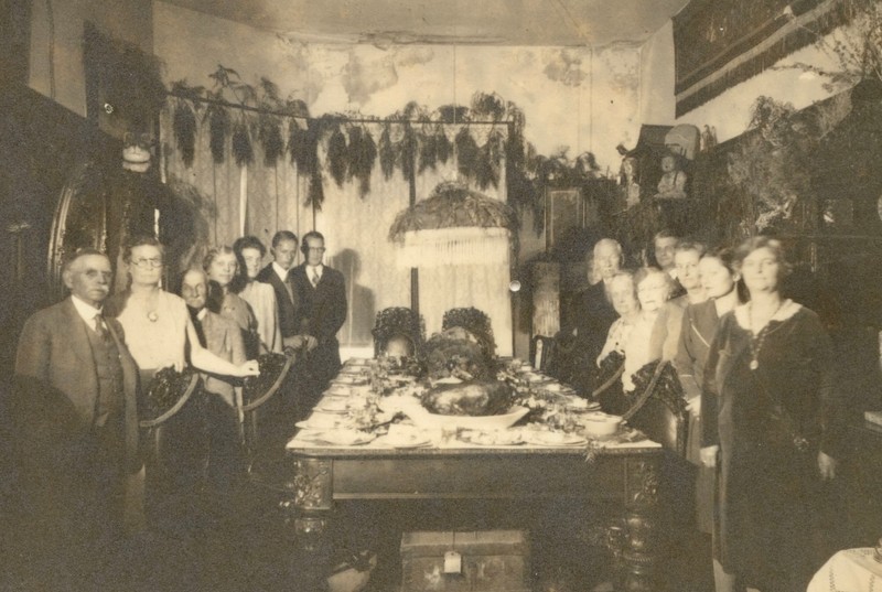 Family photo of guests ready for dinner at the Howard table