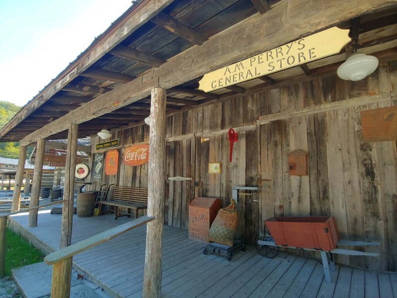 Storefronts frequently had metal signs advertising soda and other products from major companies.