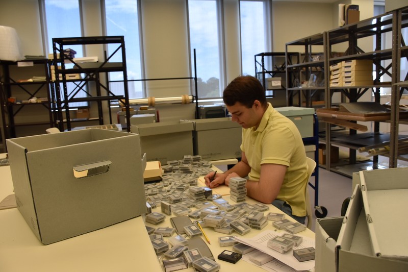 Graduate Assistant Processing Materials in the Archives Workroom