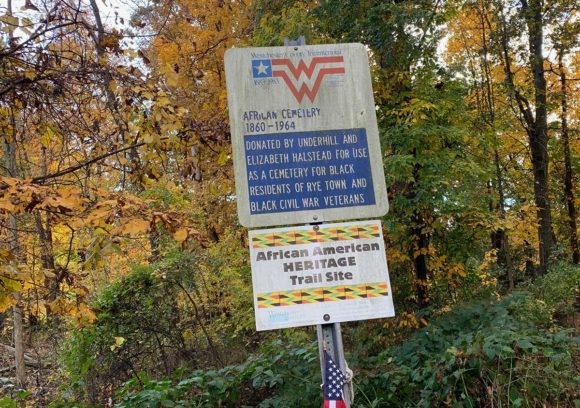 A sign introducing the cemetery to visitors.