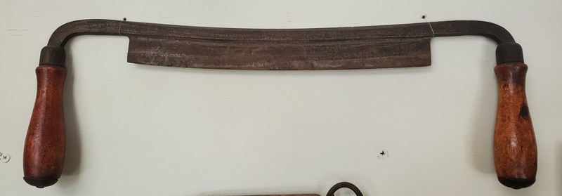 Drawknife: Used to shape wood, often used in the making of masts and spars.