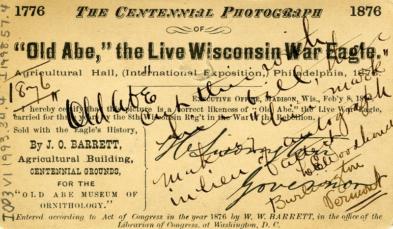 “’Old Abe’ the Live Wisconsin War Eagle, Agricultural Hall (International Exposition), Philadelphia, 1876.” Writing over the printed text notes the cut in the image made by Old Abe’s bill, a mark made in lieu of an autograph. 