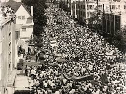 Protestors march in downtown Berkeley after law enforcement and National Guard is called in to occupy the newly created "People's Park" and "People's Park Annex" (May 30, 1969)