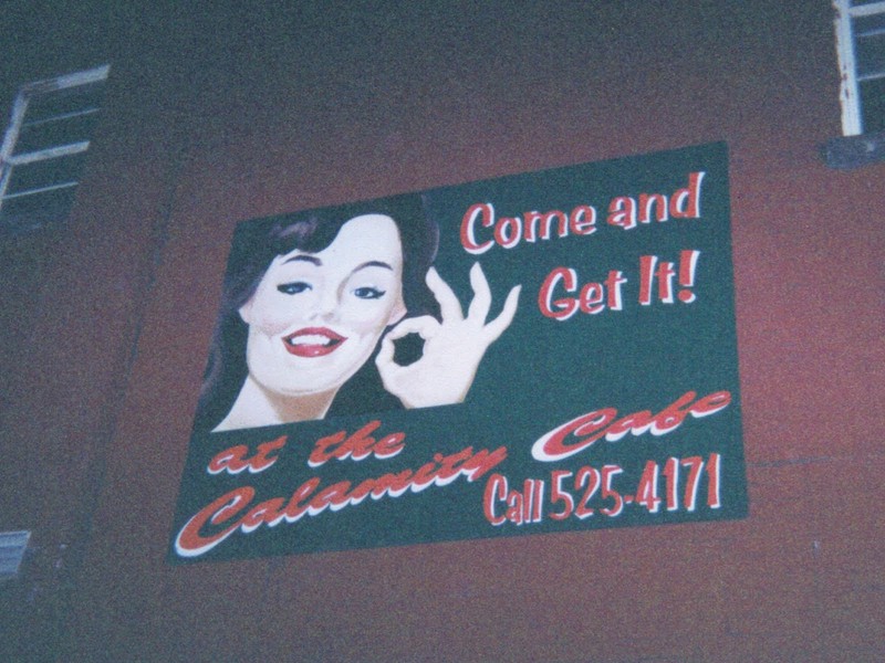 A sign inside Calamity Cafe