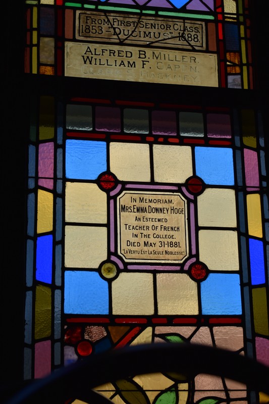 A stained glass window with tributes and mentions of important people; Alfred B. Miller, William F. Capen, Clark S. Hackney, and Mrs. Emma Hoge.