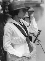 A yeoman (F) on Submarine K-5 gazes through her binoculars.