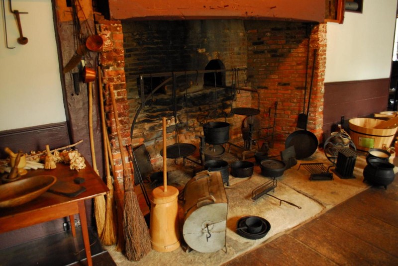A close-up of the large fireplace in the castle's kitchen.
