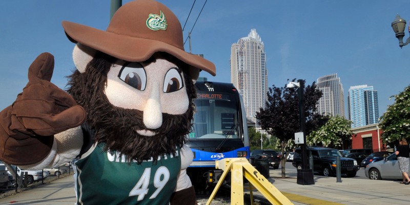 UNC Charlotte mascot, Norm the Miner, celebrates the groundbreaking for the LYNX Blue Line Extension in uptown Charlotte on July 18, 2013.