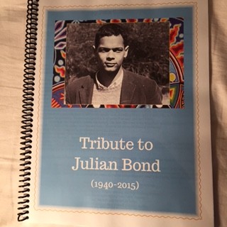 The photo memorial book created that contains photos of people honoring Julian Bond's life.