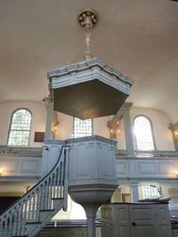 A side view of Trinity's unique, chalice-shaped pulpit.