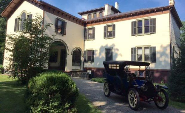 An Antique Cadillac Parked In Front of Locust Grove for an Antique Car Show