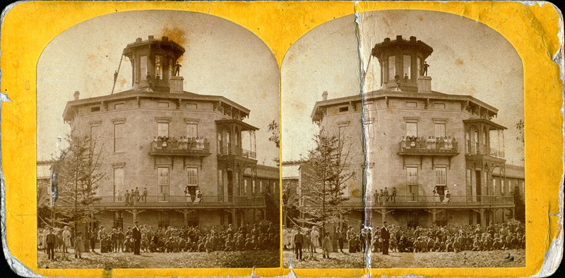 Stereoview of Harvey Hospital Soldiers and Orphans Home. Gathered in front of the Home are children posing in front of the Home. 