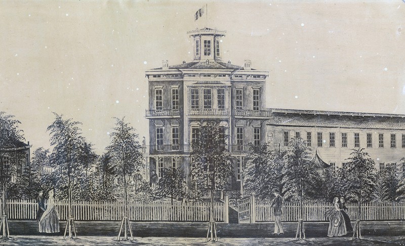 Drawing of Harvey Hospital, Madison, Wisconsin, sent to Mrs. Cordelia Harvey, the first superintendent of the hospital, and of the orphanage that was later established there. In the drawing, the Home is featured with soldiers seated and standing on the porch while civilians walk past. 