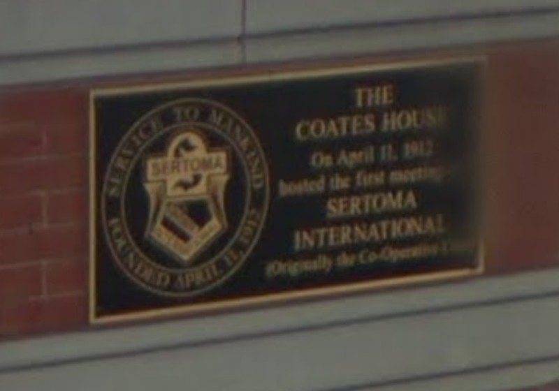 A picture of the Sertoma plaque in front of the hotel located on the corner of 10th and Broadway.